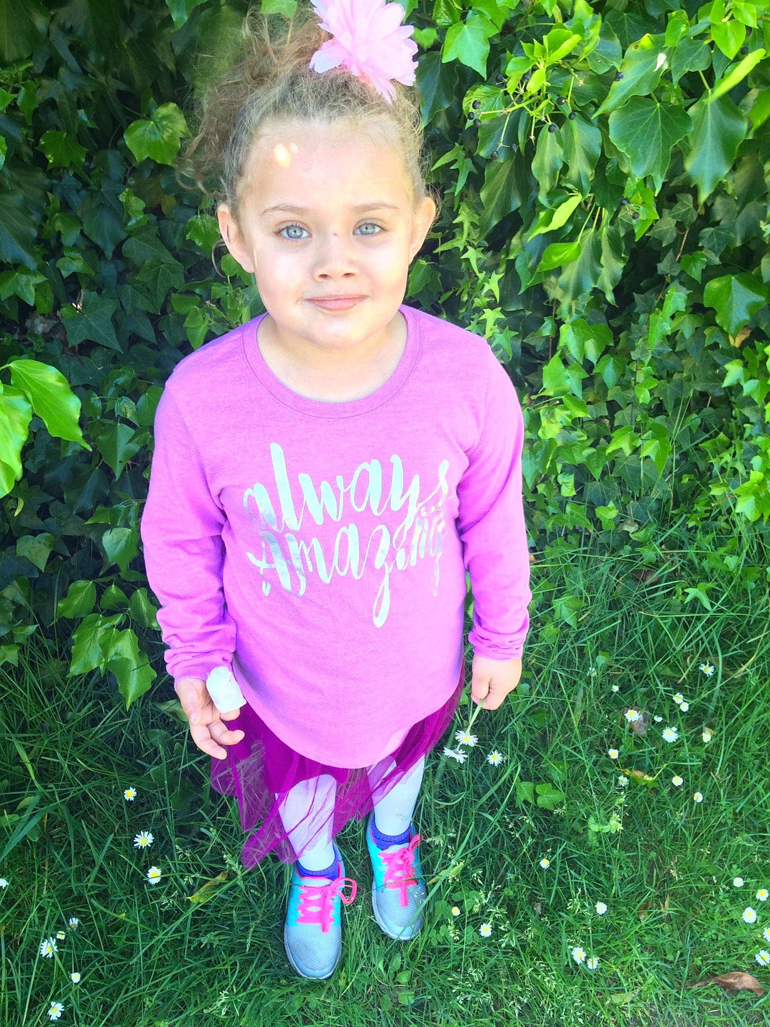 Liliana joined the competition — help win amazing prizes! child, child_model, flower, grass, green, happy, joy, leaf, magenta, person, pink, plant, purple, sleeve, smile, t_shirt, toddler, violet