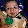 Atreus joined the competition — help win amazing prizes! baby, smile, blanket, pacifier, stuffed_animal, child, face, hand, space_theme, planet, star, cosmic, cute, infant, portrait, soft_toy, happy, indoors, clothing, closeup
