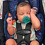 Atreus joined the competition — help win amazing prizes! baby, infant, car_seat, pacifier, sleeping, child, straps, safety_harness, clothing, shoes, footwear, space_theme, cushion, indoor, cute, resting, head, face, hand, legs