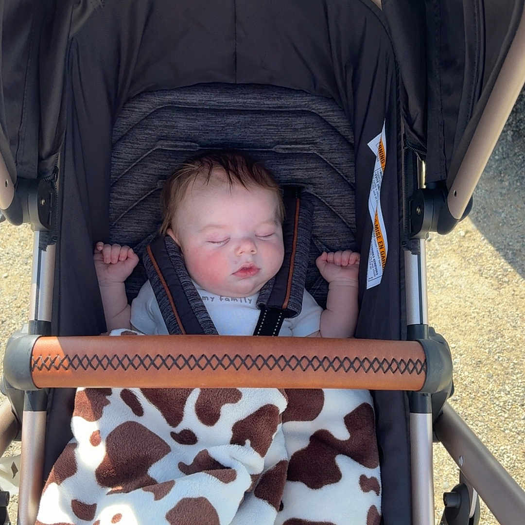 Rylan joined the competition — help win amazing prizes! baby, bed, car, car_interior, clothing, cradle, crib, face, furniture, hat, head, infantbed, newborn, person, photography, portrait, sleeping, stroller, transportation, vehicle