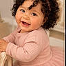 Amaya joined the competition — help win amazing prizes! baby, girl, curly_hair, pink_bow, headband, pink_dress, smiling, happy, child, cute, portrait, indoor, furniture, toddler, cheerful, cute_face, soft_lighting, skin, long_sleeves, fashion