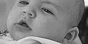 Alina participe au concours pour gagner de l'argent avec cette photo : baby, infant, child, arm, face, eyes, person, skin, hand, black_and_white, portrait, closeup, expression, young, cute, candid, curious, holding, background, nature