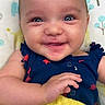 Sage joined the competition — help win amazing prizes! baby, smiling, infant, towel, blue_clothing, red_stars, lying_down, blanket, patterned_blanket, trees_pattern, animal_pattern, happy, closeup, face, skin, child, cute, indoors, portrait, baby_girl