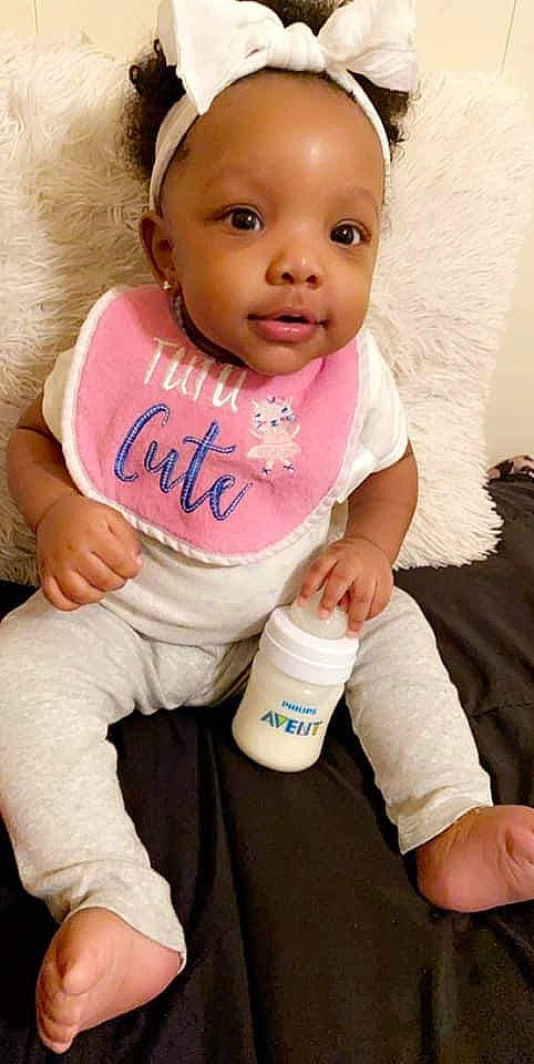 Ivey is registered to the contest to win money with this photo: baby, baby_products, baby_toddler_clothing, cheek, child, lip, person, pink, product, skin, smile, toddler