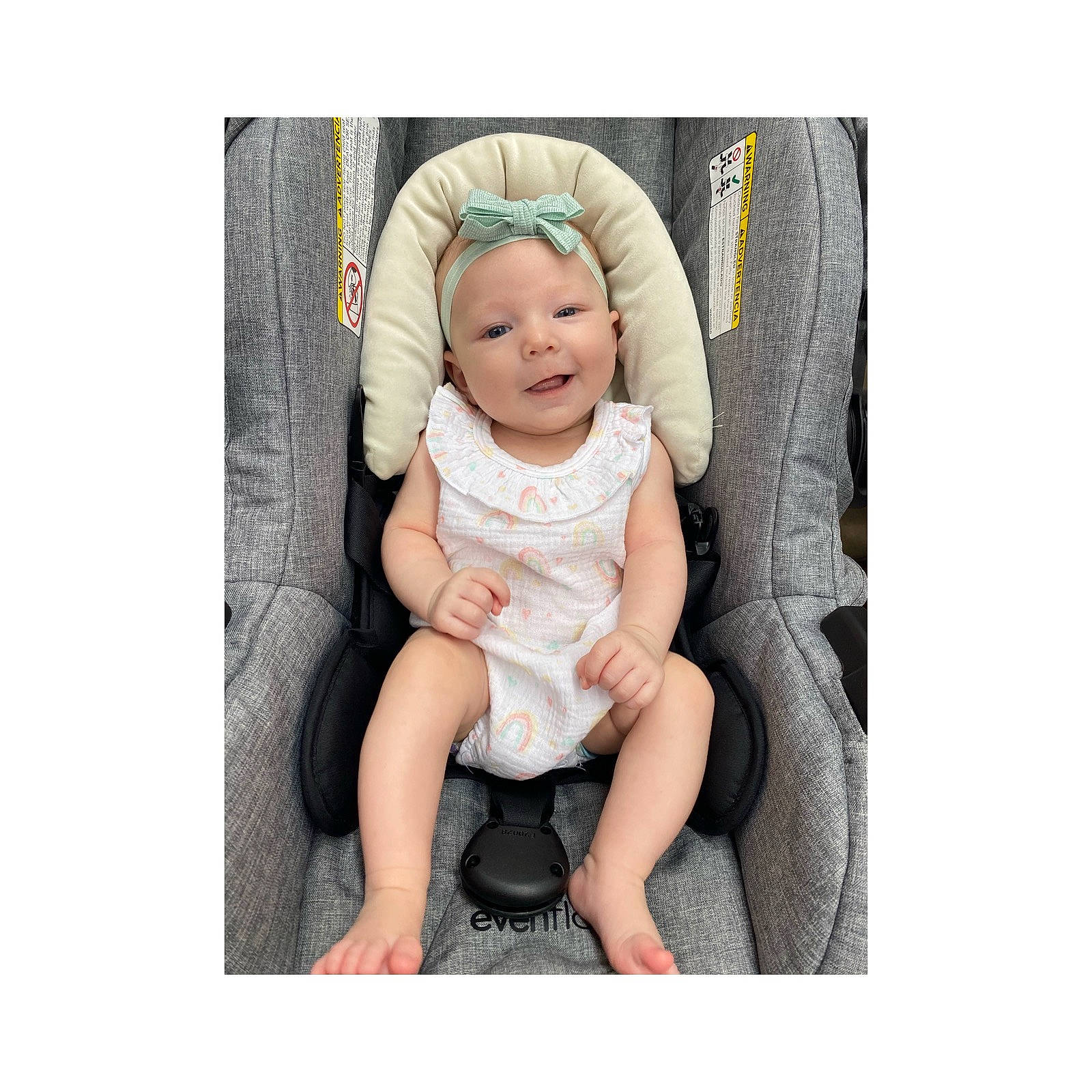 Rhyleigh is registered to the contest to win money with this photo: baby, baby_safety, baby_toddler_clothing, collar, comfort, eye, face, gesture, grey, hand, happy, head, headwear, human_body, leg, linens, person, product, sleeve, smile