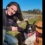 Phatbaby joined the competition — help win amazing prizes! person, dog, leash, outdoor, sunny, grass, road, blue_sky, casual_clothing, happy, tongue_out, sitting, nature, smiling, young_adult, black_and_white_dog, jeans, nike_sweatshirt, sidewalk, daylight