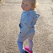 Natalie is registered to the contest to win money with this photo: toddler, child, hoodie, rainbow, heart, leggings, sneakers, pink_shoes, outdoor, path, sunlight, portrait, walking, curious, playful, casual_clothing, young_child, fashion, daylight, cute
