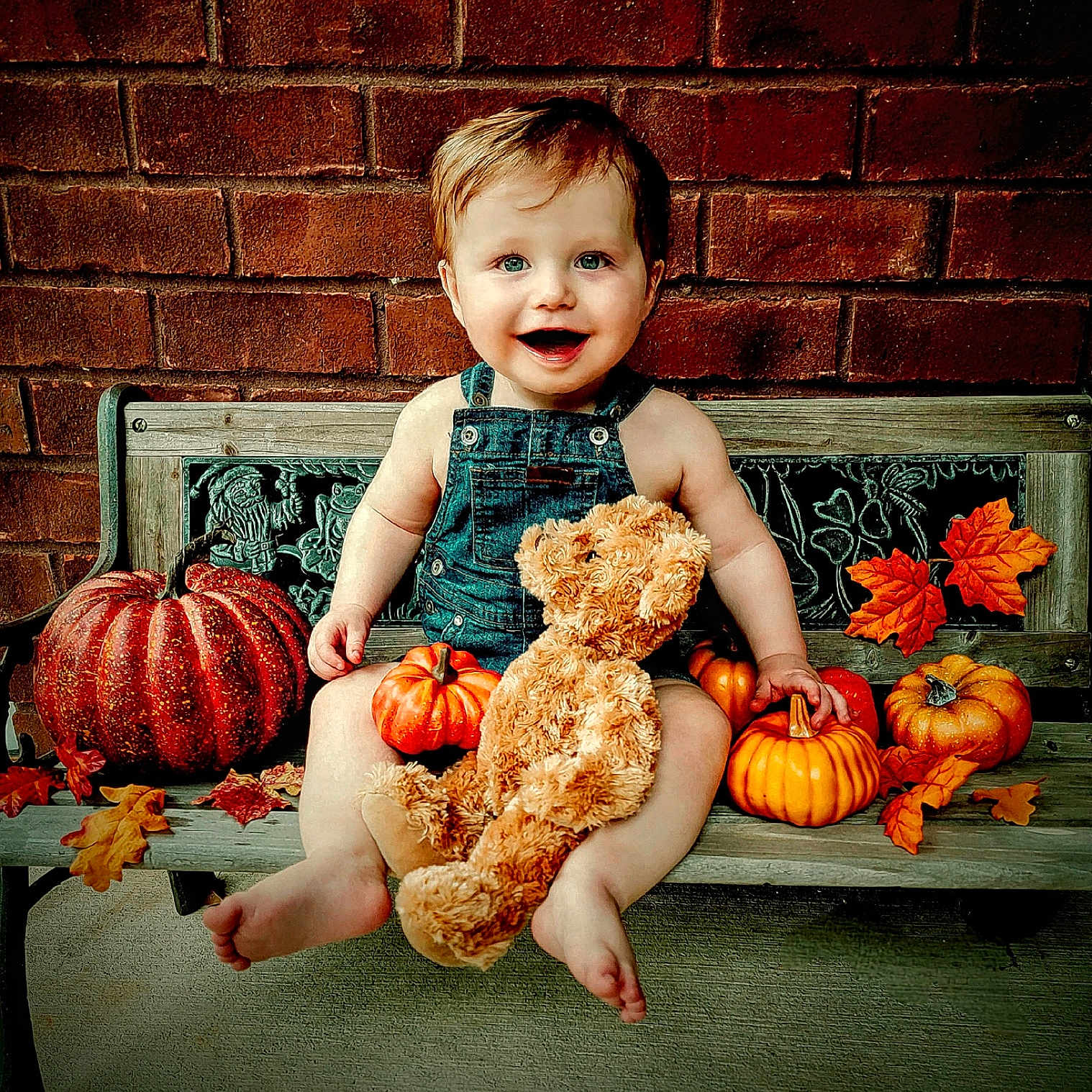 Rowan is registered to the contest to win money with this photo: baby, bodypart, brick, face, finger, food, hand, head, leaf, person, photography, plant, portrait, produce, pumpkin, sitting, squash, teddybear, toy, vegetable