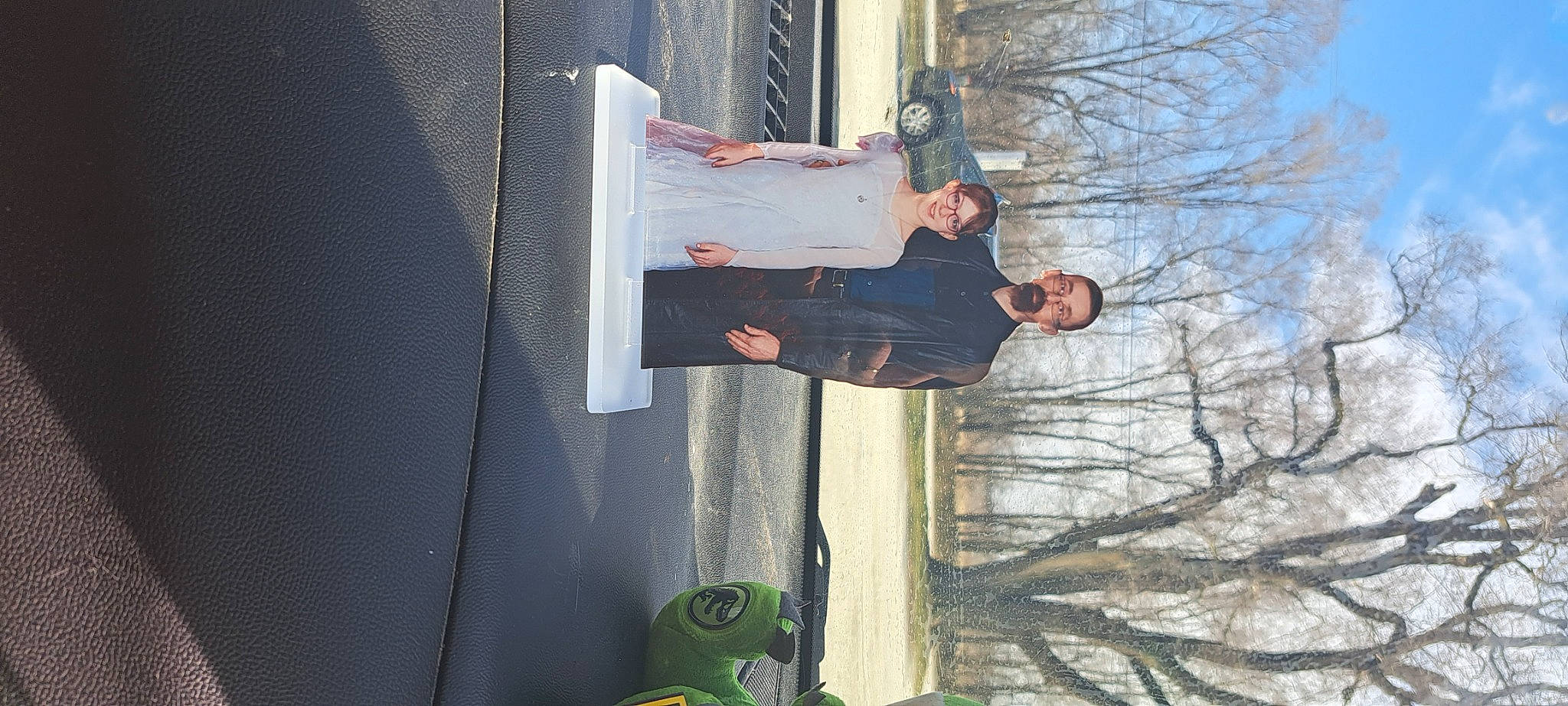 Angel Woodall is registered to the contest to win money with this photo: automotive_exterior, car, composite_material, electric_blue, joy, person, sky, travel, tree, twig, vehicle_door, walking_shoe, wood, wrist