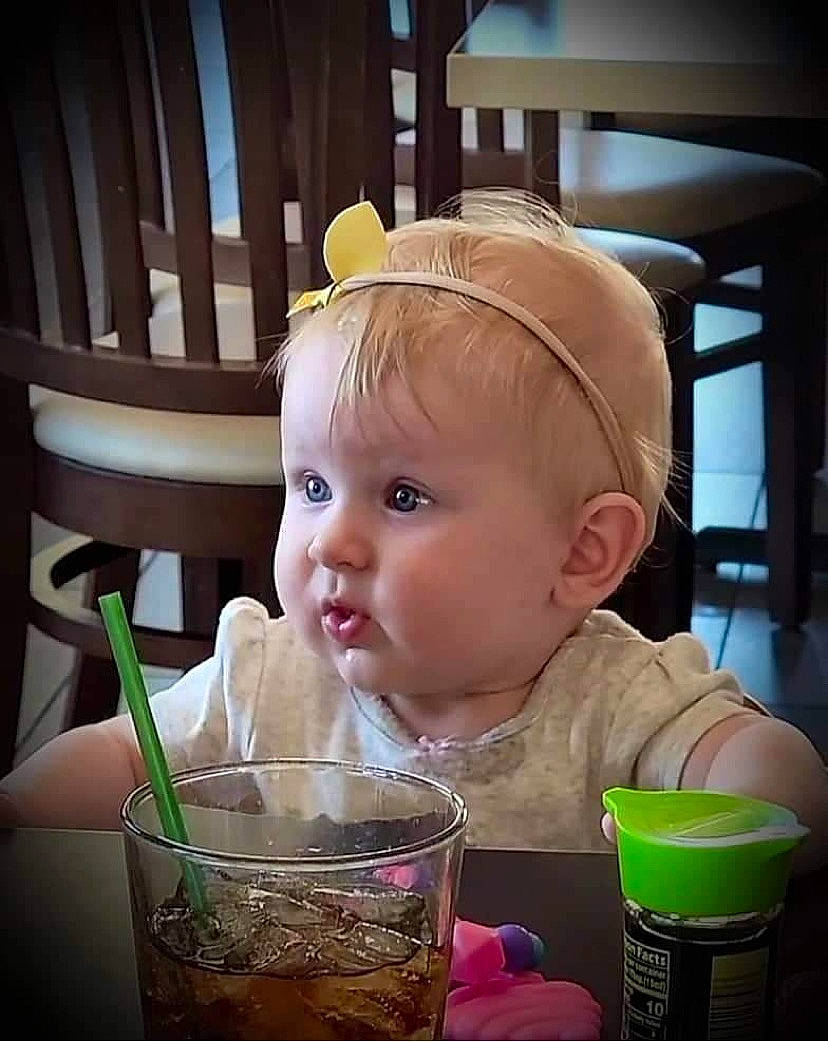 Zaya joined the competition — help win amazing prizes! baby, baby_toddler_clothing, chair, cheek, child, cup, drink, drinking, drinking_straw, drinkware, food, food_craving, hairstyle, happy, organ, person, product, skin, table, tableware