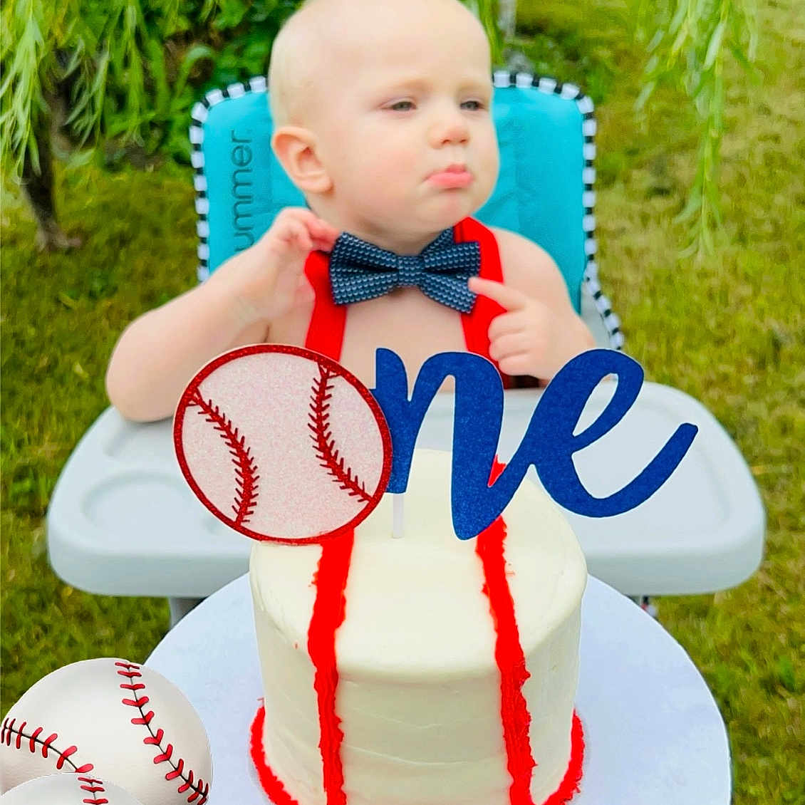 Michael is registered to the contest to win money with this photo: baby, ball, baseball, baseballball, birthdaycake, cake, cream, dessert, face, food, grass, head, icing, people, person, photography, plant, portrait, sport, tree