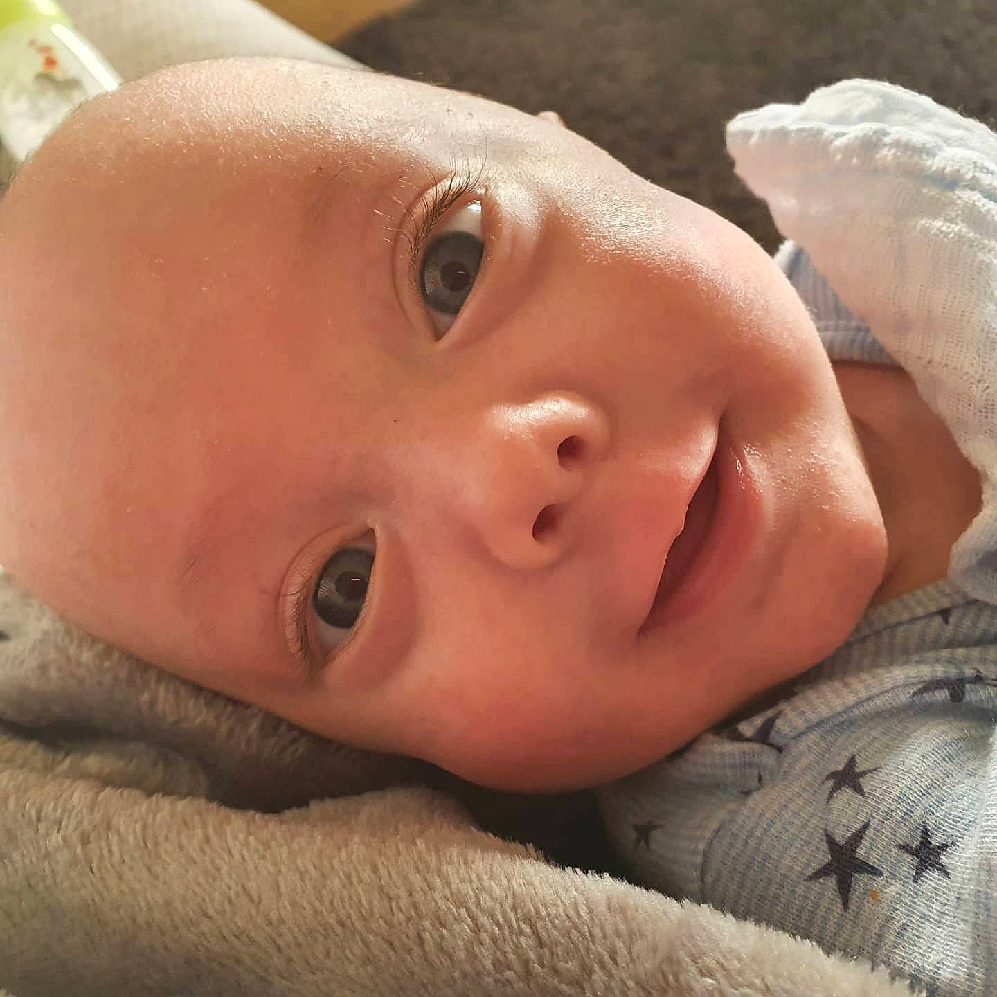 Ellis is registered to the contest to win money with this photo: baby, cheek, dress, ear, eye, eyebrow, eyelash, face, facial_expression, forehead, happy, human_body, iris, lip, mouth, nose, person, skin, smile, toddler