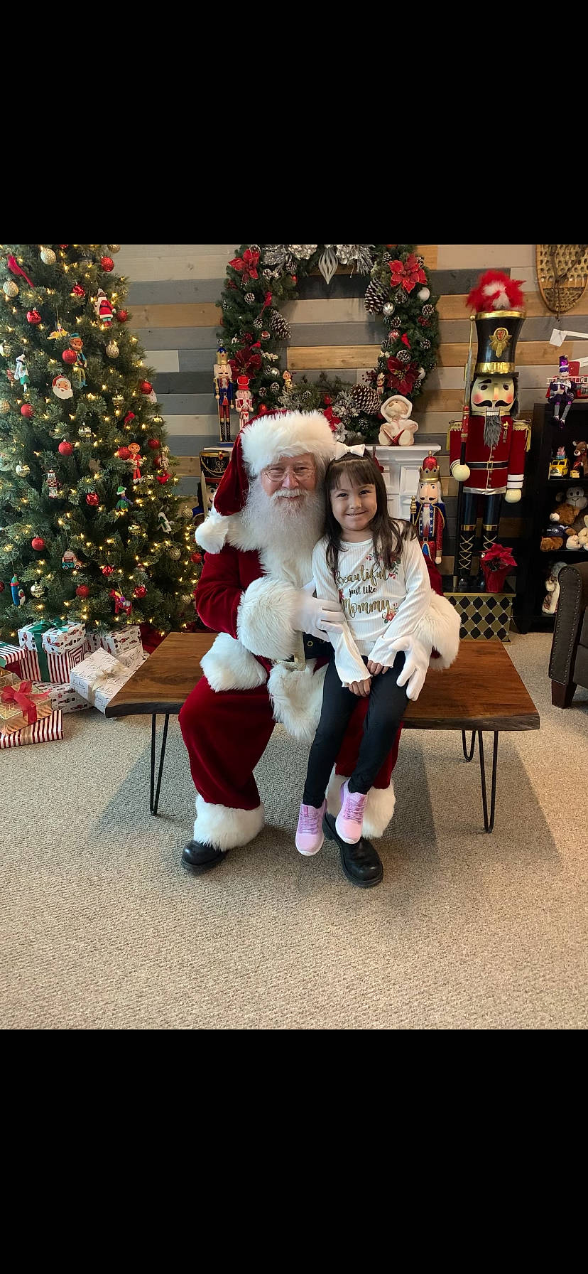 Lena joined the competition — help win amazing prizes! chair, christmas, christmas_decoration, christmas_eve, christmas_ornament, christmas_tree, event, fun, happy, hat, headwear, holiday, holiday_ornament, joy, lap, ornament, person, santa_claus, smile, toy