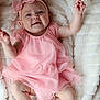 baby, infant, pink_dress, headband, bow, blanket, smiling, happy, cute, child, soft_texture, lying_down, skin, small_hands, small_feet, indoors, portrait, adorable, toddler, cozy