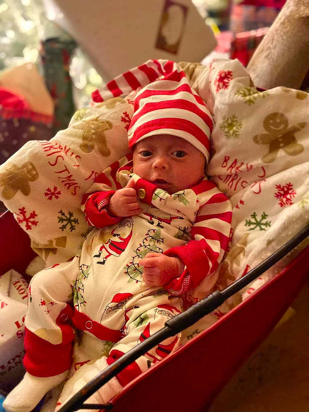 Jerran joined the competition — help win amazing prizes! baby, baby_products, baby_toddler_clothing, carmine, child, christmas, christmas_eve, comfort, event, facial_expression, fictional_character, fun, happy, headwear, holiday, linens, person, room, santa_claus, sleeve