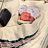 Isabella is registered to the contest to win money with this photo: newborn, baby, infant, sleeping, swaddled, blanket, hospital, bassinet, hat, bow, pastel, portrait, face, closed_eyes, peaceful, cozy, nursery, medical_care, striped_blanket, bed