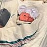 newborn, baby, infant, child, face, eyes, hospital, bassinet, swaddle, blanket, bow, hat, striped, pastel, portrait, lying_down, cozy, indoors, medical_setting, newborn_photography