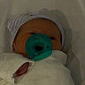 Isabella joined the competition — help win amazing prizes! baby, infant, child, sleeping, pacifier, hat, striped_hat, blanket, swaddled, portrait, face, eyes, nose, mouth, indoors, nursery, cozy, bed, soft_lighting, close_up