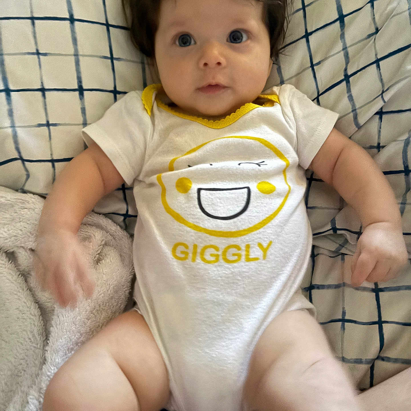 Millie joined the competition — help win amazing prizes! baby, bib, blanket, bodypart, clothing, couch, cushion, face, finger, furniture, hand, head, homedecor, newborn, person, photography, portrait, shorts, sitting, t_shirt