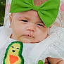 baby, child, face, headband, green_bow, avocado_patch, white_clothing, cute, portrait, closeup, infant, expression, fashion, baby_fashion, outdoor, grass, blanket, texture, skin, person