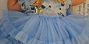 Layla is registered to the contest to win money with this photo: baby, pacifier, blue_outfit, headband, socks, infant, sleeping_area, soft_surface, cute, child, lying_down, sleepwear, tutu_skirt, patterned_clothing, newborn, peaceful, indoors, small_hands, side_profile, cozy