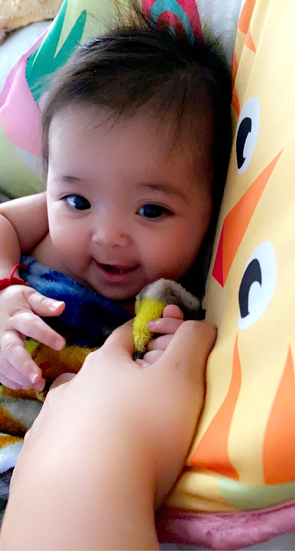 Luna is registered to the contest to win money with this photo: baby_playing_with_toys, cheek, chin, eye, face, facial_expression, finger, hairstyle, hand, happy, head, human, lip, mouth, nose, organ, person, product, skin, smile