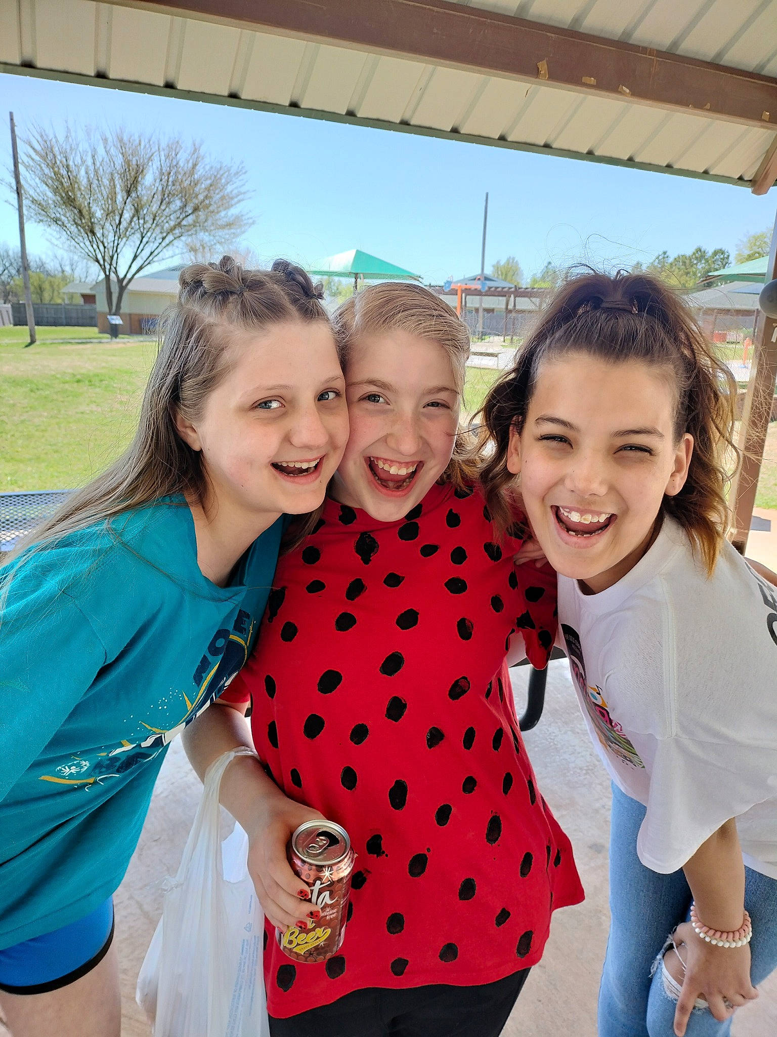 Anna is registered to the contest to win money with this photo: child, event, facial_expression, family_taking_photos_together, friendship, fun, gesture, hairstyle, happy, joy, leisure, pattern, person, recreation, skin, sky, smile, t_shirt, team, toddler