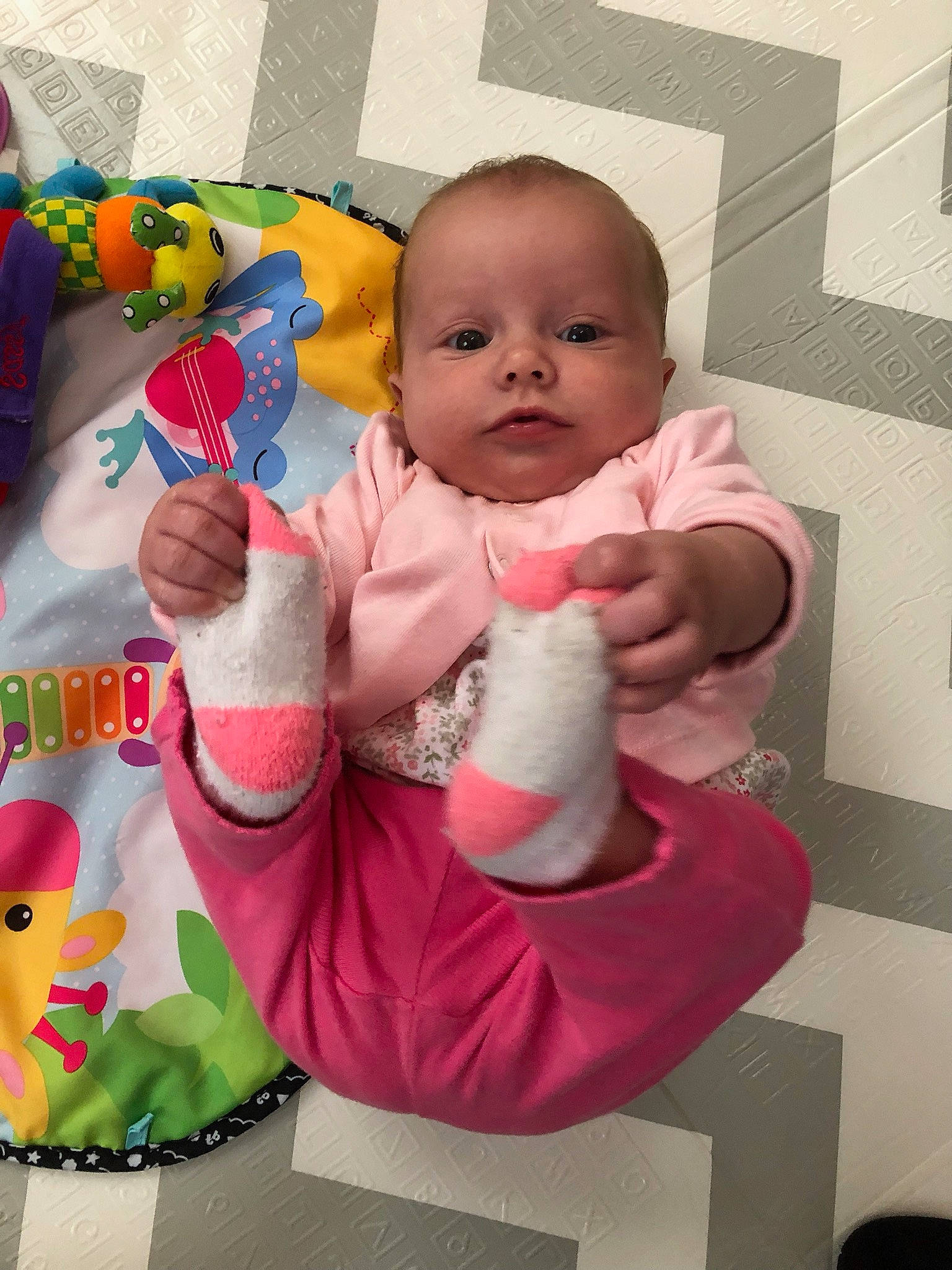 Mckenzie is registered to the contest to win money with this photo: baby, baby_products, baby_toddler_clothing, cheek, child, comfort, event, finger, fun, gesture, happy, nail, person, pink, product, sitting, skin, stuffed_toy, textile, thumb
