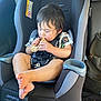 toddler, child, car_seat, sandwich, eating, food, seatbelt, interior, car, seat, clothing, hair, foot, hand, face, child_seat, babytrend, window, bag, safety