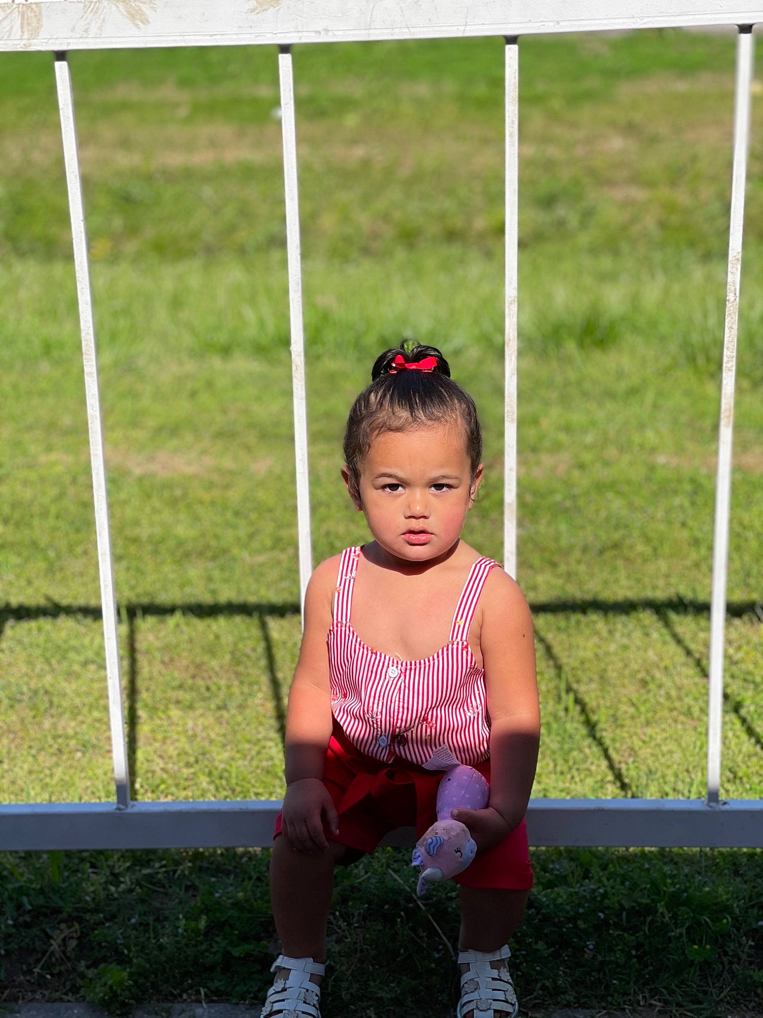 Lillyanna joined the competition — help win amazing prizes! baby_toddler_clothing, child, eye, footwear, fun, grass, grassland, happy, jewellery, leisure, magenta, pattern, person, recreation, shoe, sneakers, sock, sunglasses, swing, toddler