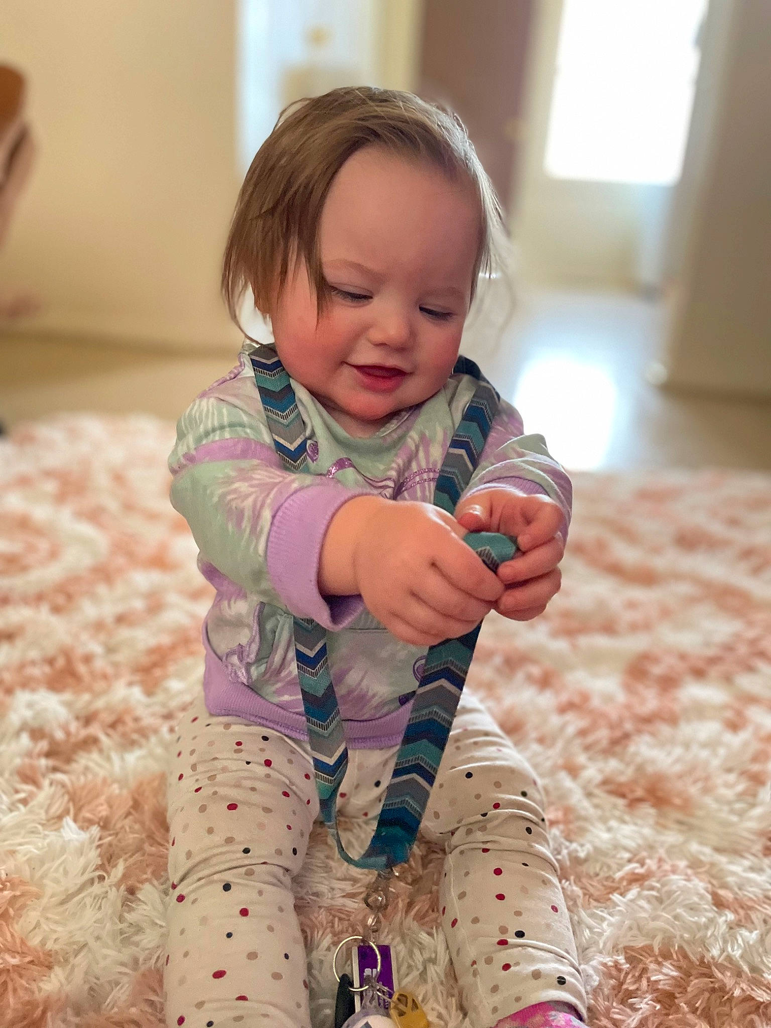 Addisyn joined the competition — help win amazing prizes! baby, baby_toddler_clothing, comfort, face, finger, flooring, fun, hand, happy, head, leg, pattern, person, pink, skin, sleeve, smile, sock, thumb, toddler
