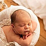Ethan participe au concours pour gagner de l'argent avec cette photo : baby, newborn, infant, sleeping, eyes_closed, peaceful, wicker_basket, blanket, soft_texture, newborn_pose, basket, wooden_floor, portrait, close_up, chubby_cheeks, tiny_hands, studio_photography, cozy, props, skin