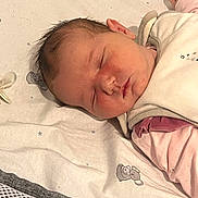 Miya participe au concours pour gagner de l'argent avec cette photo : baby, sleeping, blanket, teddy_bear, infant, face, peaceful, soft_texture, clothing, bed, cute, newborn, resting, child, pink, white, pattern, fabric, indoors, portrait