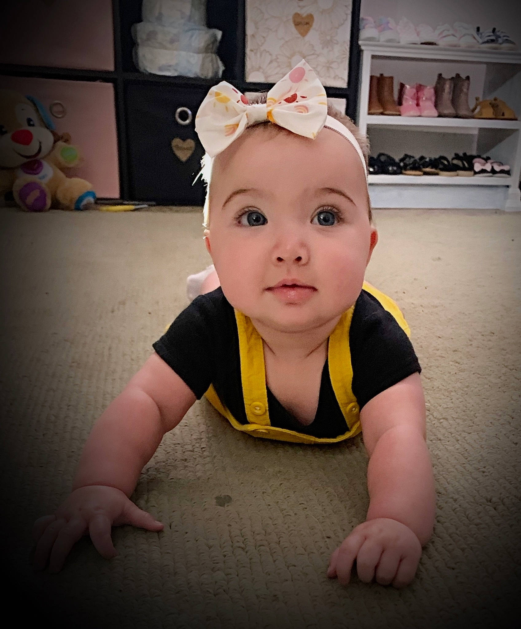 Shelby joined the competition — help win amazing prizes! baby, baby_making_funny_faces, baby_toddler_clothing, cheek, chest, child, crawling, eyelash, flash_photography, flooring, fun, happy, person, portrait_photography, room, sitting, sleeve, smile, t_shirt, toddler