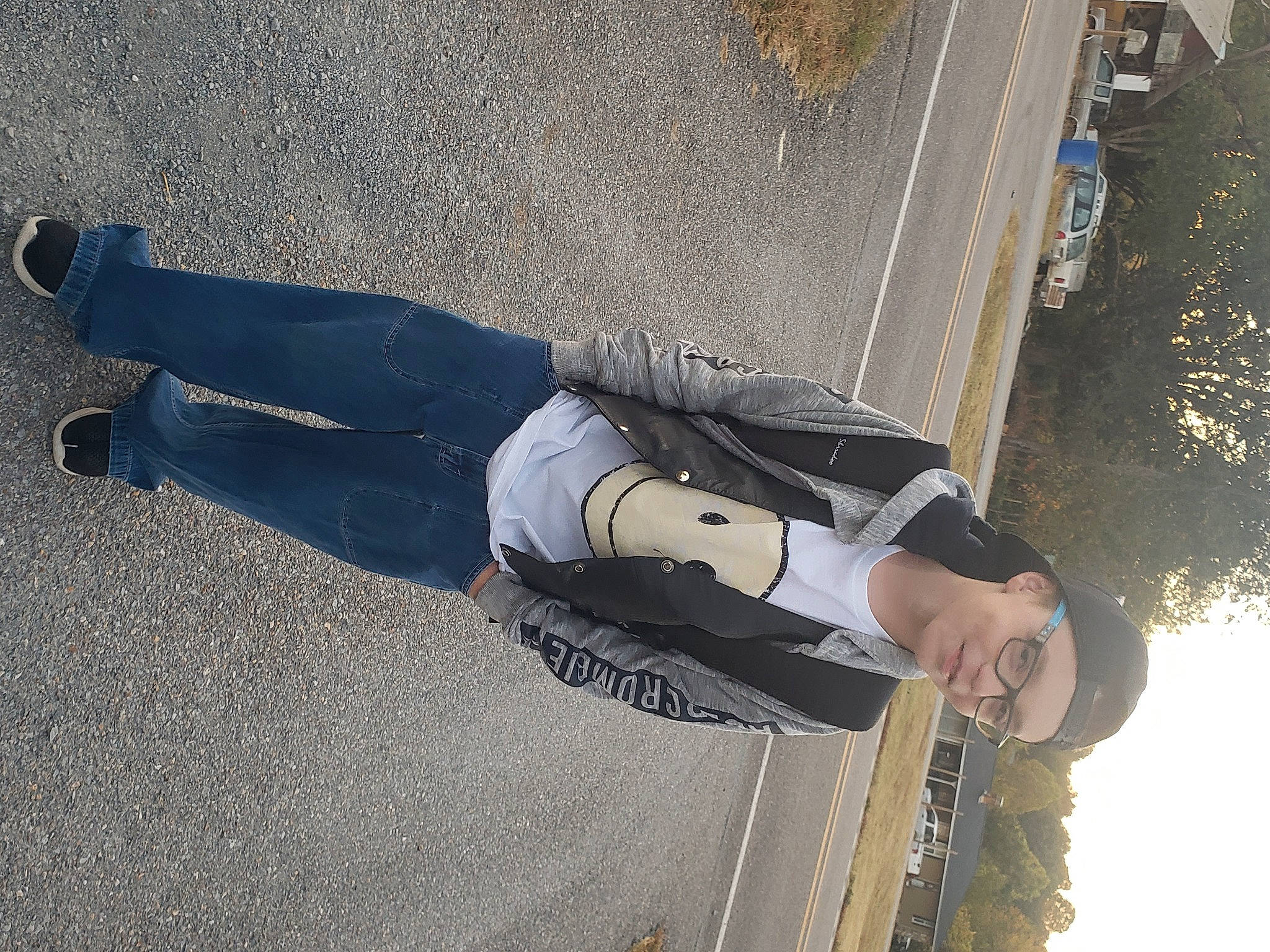 Brantley joined the competition — help win amazing prizes! asphalt, auto_part, car, denim, elbow, electric_blue, headwear, human_leg, line, pedestrian, person, recreation, road_surface, rolling, shadow, sky, tar, tints_and_shades, tire, tree