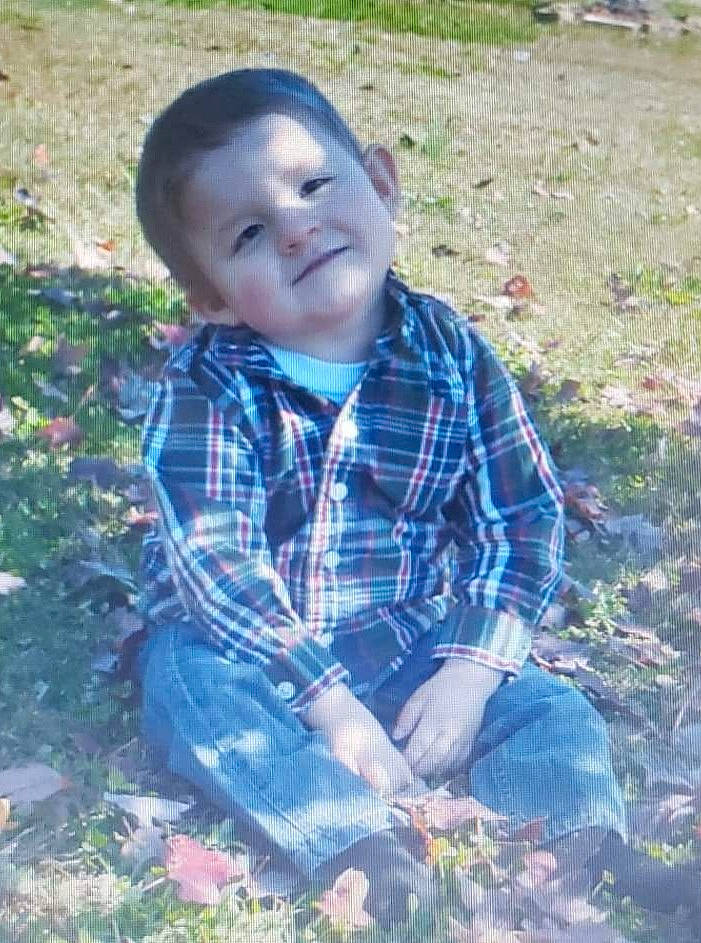 Kolton joined the competition — help win amazing prizes! baby_toddler_clothing, botany, child, face, grass, grass_family, groundcover, happy, head, joy, leaf, pattern, people_in_nature, person, plaid, plant, sitting, soil, tartan, toddler