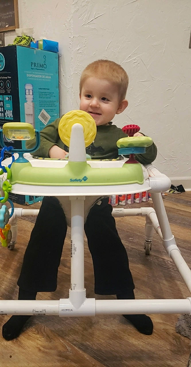 Kolton joined the competition — help win amazing prizes! baby, baby_playing_with_toys, baby_products, baby_toddler_clothing, baby_toys, balance, child, fun, joy, person, plastic, play, recreation, room, shelf, sitting, smile, stool, t_shirt, table