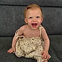 Athena participe au concours pour gagner de l'argent avec cette photo : toddler, child, smiling, happy, dress, hair_clip, sitting, couch, indoor, cute, baby, person, fabric, button, skin, face, young, clothing, comfort, joy