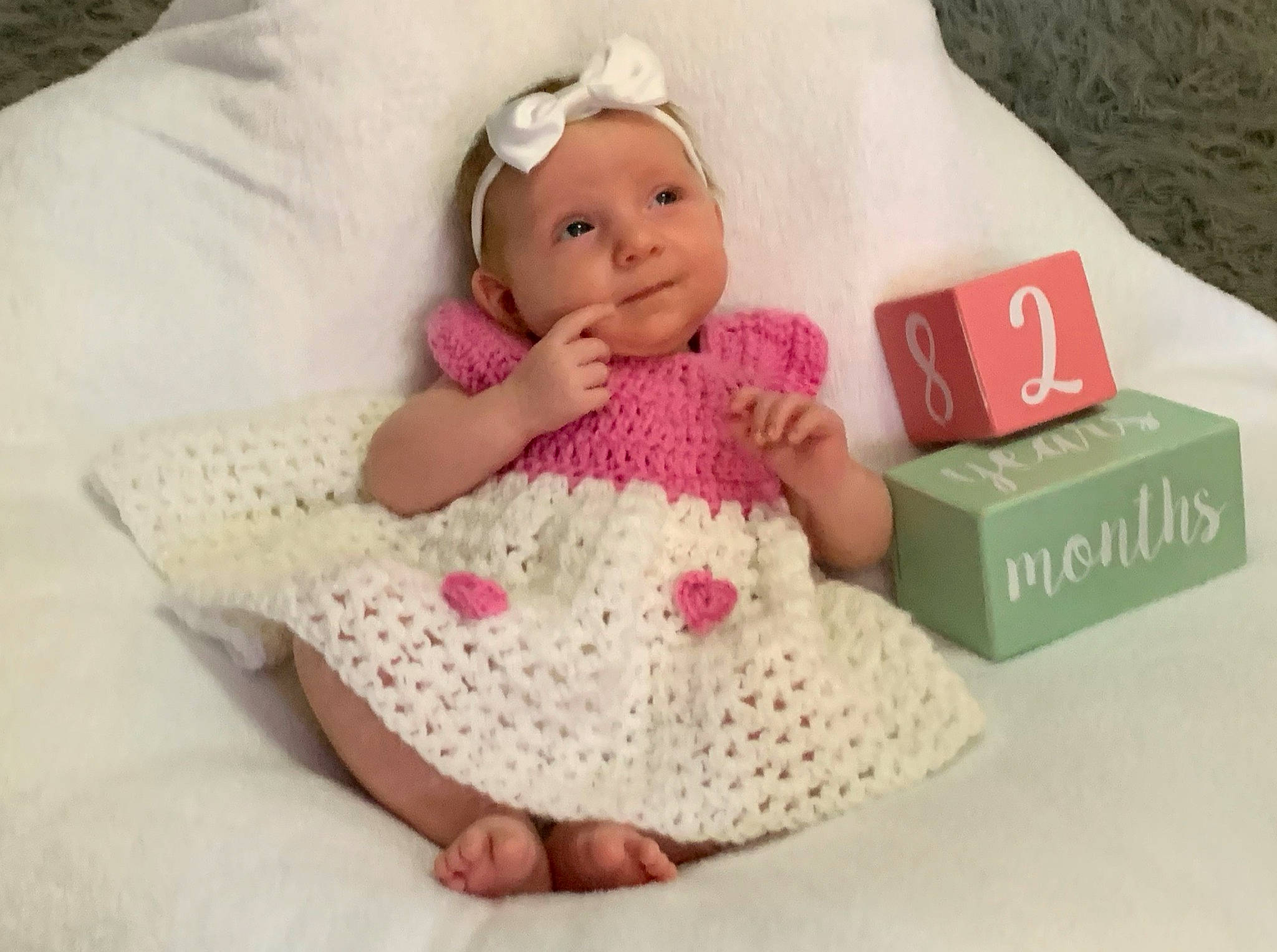 Eevee is registered to the contest to win money with this photo: art, baby, baby_products, baby_toddler_clothing, cap, cheek, child, creative_arts, doll, knit_cap, linens, pattern, person, pink, product, sleeve, textile, toddler, toy, white