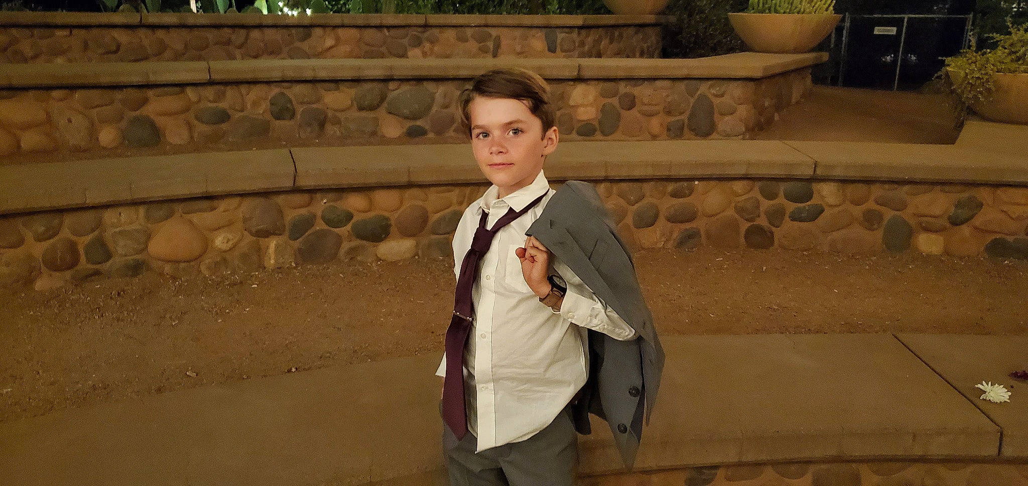 Ash is registered to the contest to win money with this photo: blazer, collar, dress_shirt, event, flash_photography, flooring, flowerpot, formal_wear, fun, happy, leisure, person, plant, sitting, sleeve, suit, temple, tourism, uniform, white_collar_worker