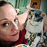 woman, cat, face, pet, indoor, blanket, cuddling, closeup, expression, fur, multicolor, person, room, background, home, comfort, relaxed, animal, portrait, colorful