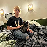 Zoriah joined the competition — help win amazing prizes! bed, bedroom, blanket, blond_hair, boy, calendar, cat, child, cozy, furry_cat, indoor, jeans, lamp, messy_bed, pet, pillow, ripped_jeans, sitting, tshirt, wall_sconce