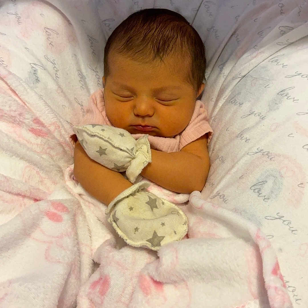 Cora is registered to the contest to win money with this photo: architecture, baby, bed, bedroom, blanket, crib, cushion, face, furniture, head, homedecor, indoors, infantbed, newborn, person, photography, portrait, quilt, room, sleeping