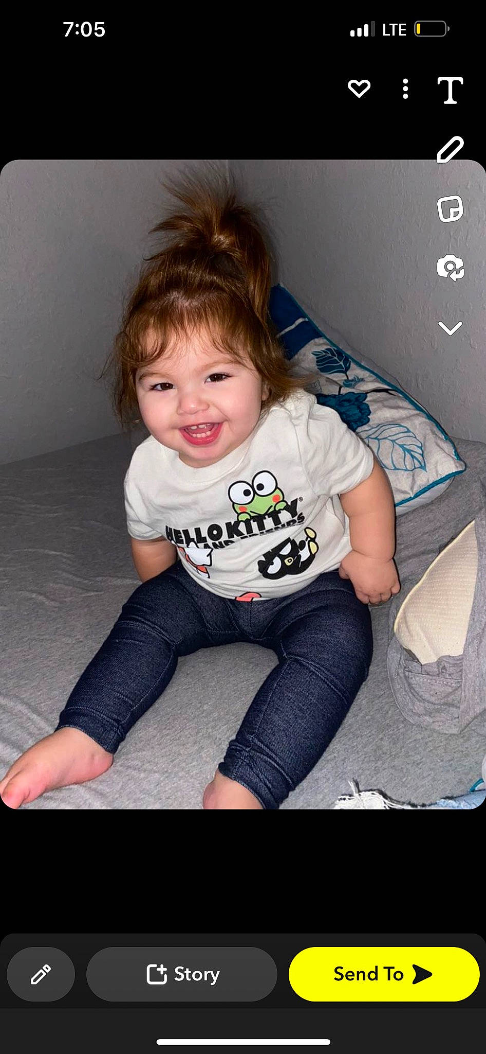 Amiyah is registered to the contest to win money with this photo: baby_toddler_clothing, blond, cheek, child, eye, flash_photography, fun, hair, hairstyle, happy, human_leg, iris, joy, knee, person, sitting, skin, sleeve, smile, t_shirt