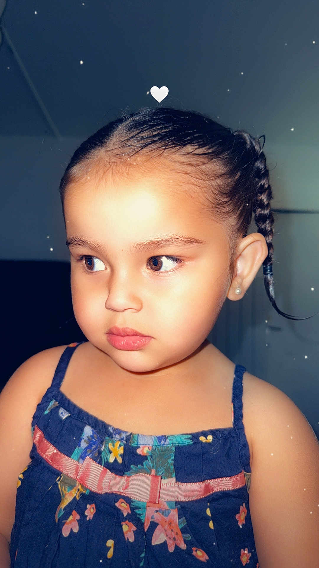 Kayna participe au concours pour gagner de l'argent avec cette photo : braided_hair, child, childhood, closeup, cute, dress, earring, expression, face, fashion, floral_pattern, girl, hair, heart_overlay, indoors, person, portrait, skin, soft_lighting, young