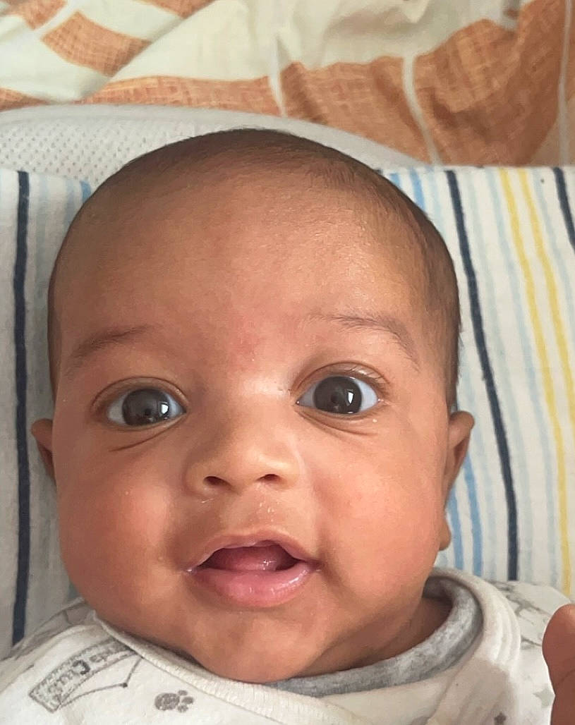 Eden participe au concours pour gagner de l'argent avec cette photo : baby, baby_toddler_clothing, cheek, child, chin, comfort, ear, eyebrow, eyelash, forehead, happy, iris, linens, lip, mouth, nose, person, skin, smile, toddler