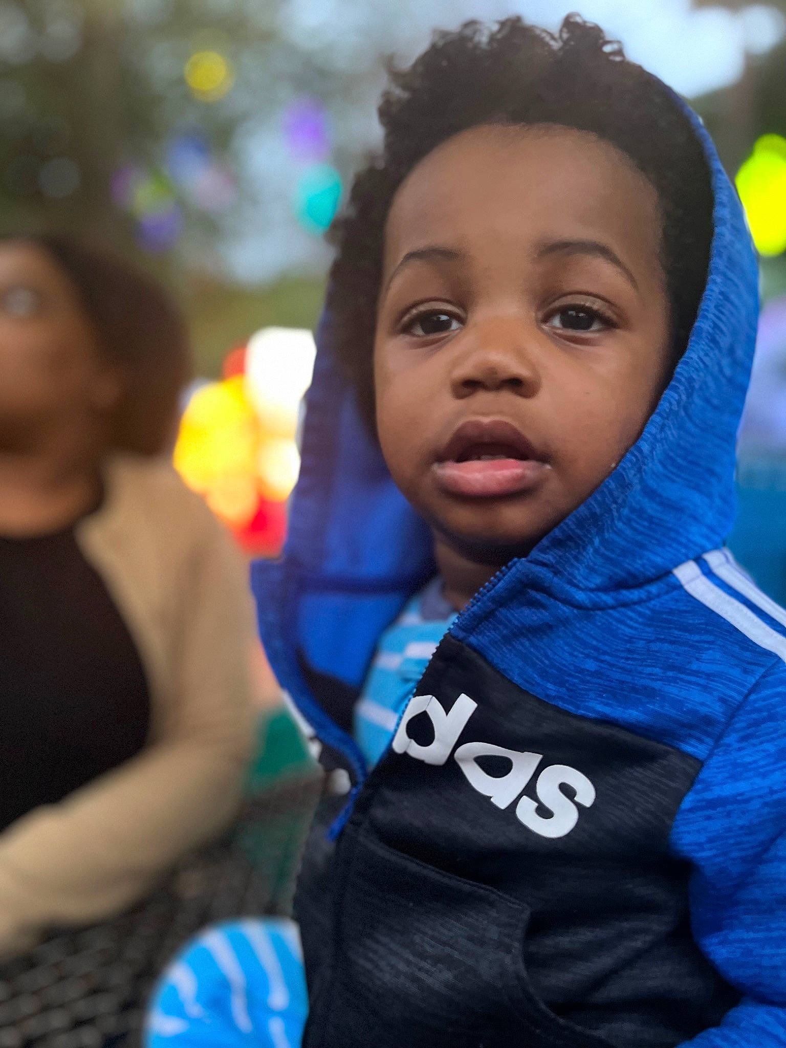 Kingston is registered to the contest to win money with this photo: blue, child, crowd, electric_blue, event, fun, hair, hairstyle, happy, hoodie, jacket, leisure, person, personal_protective_equipment, recreation, toddler, tradition, tree, vacation, winter