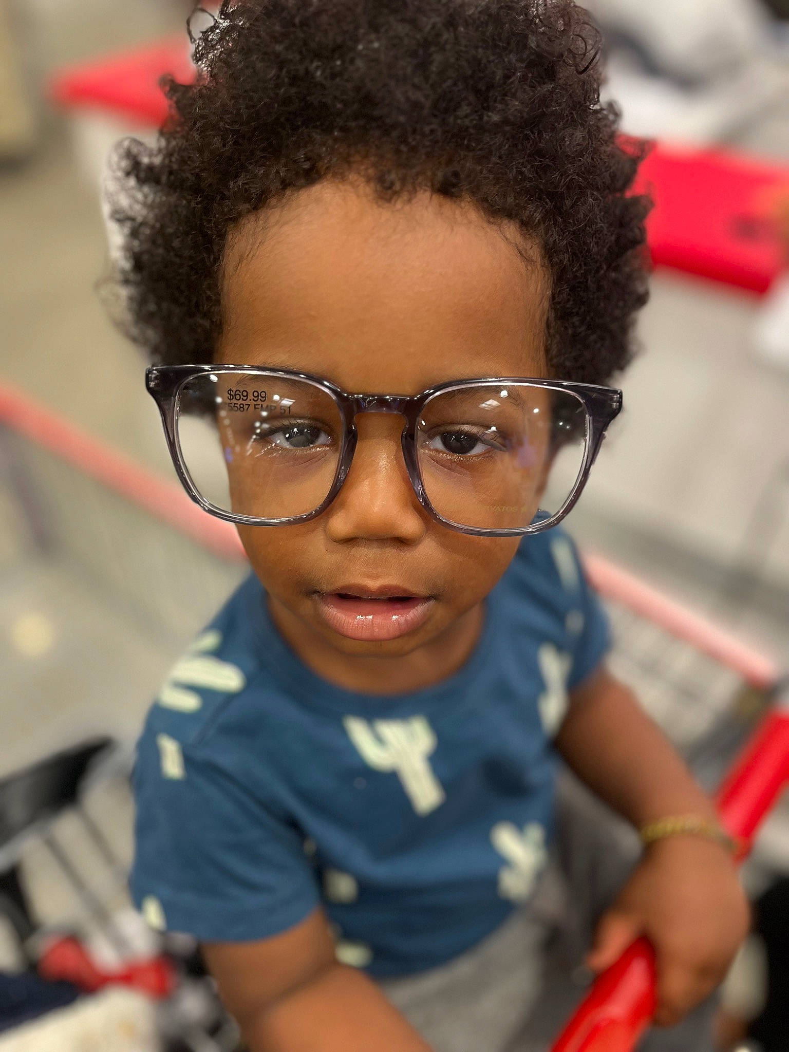 Kingston is registered to the contest to win money with this photo: afro, child, chin, cool, engineering, eyelash, eyewear, fashion_design, flash_photography, forehead, fun, glasses, hairstyle, happy, jheri_curl, nose, person, personal_protective_equipment, t_shirt, toddler