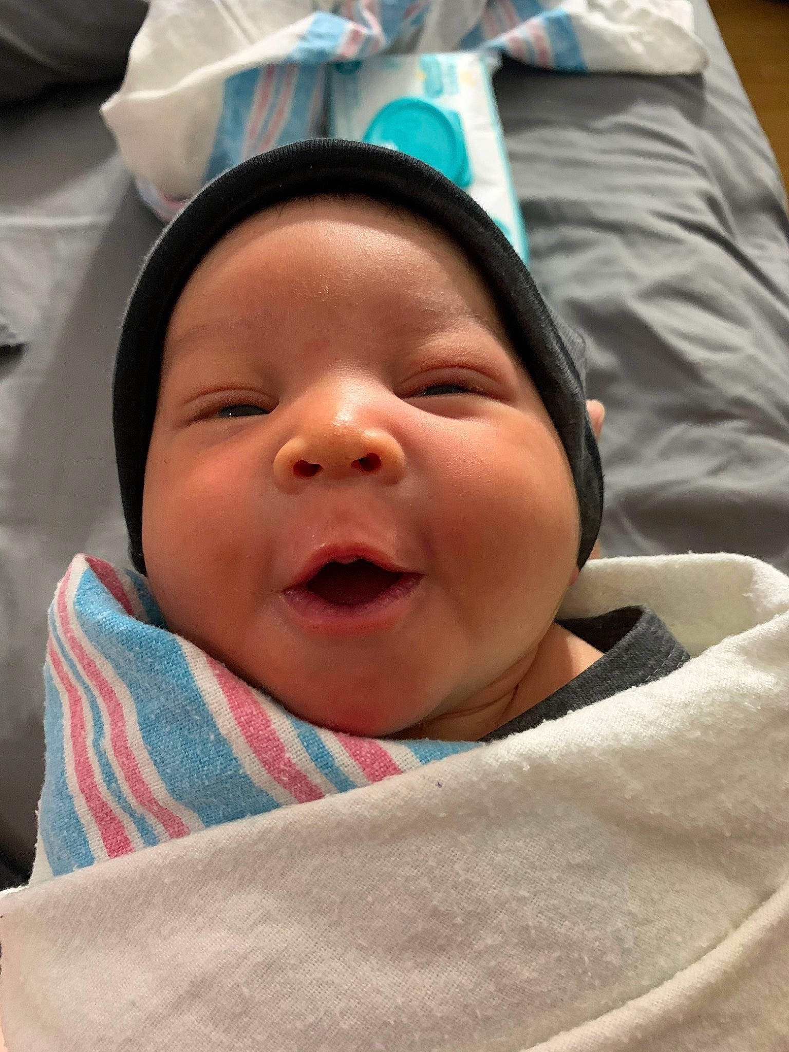 London is registered to the contest to win money with this photo: baby, birth, cheek, child, facial_expression, headwear, person, skin, smile, toddler