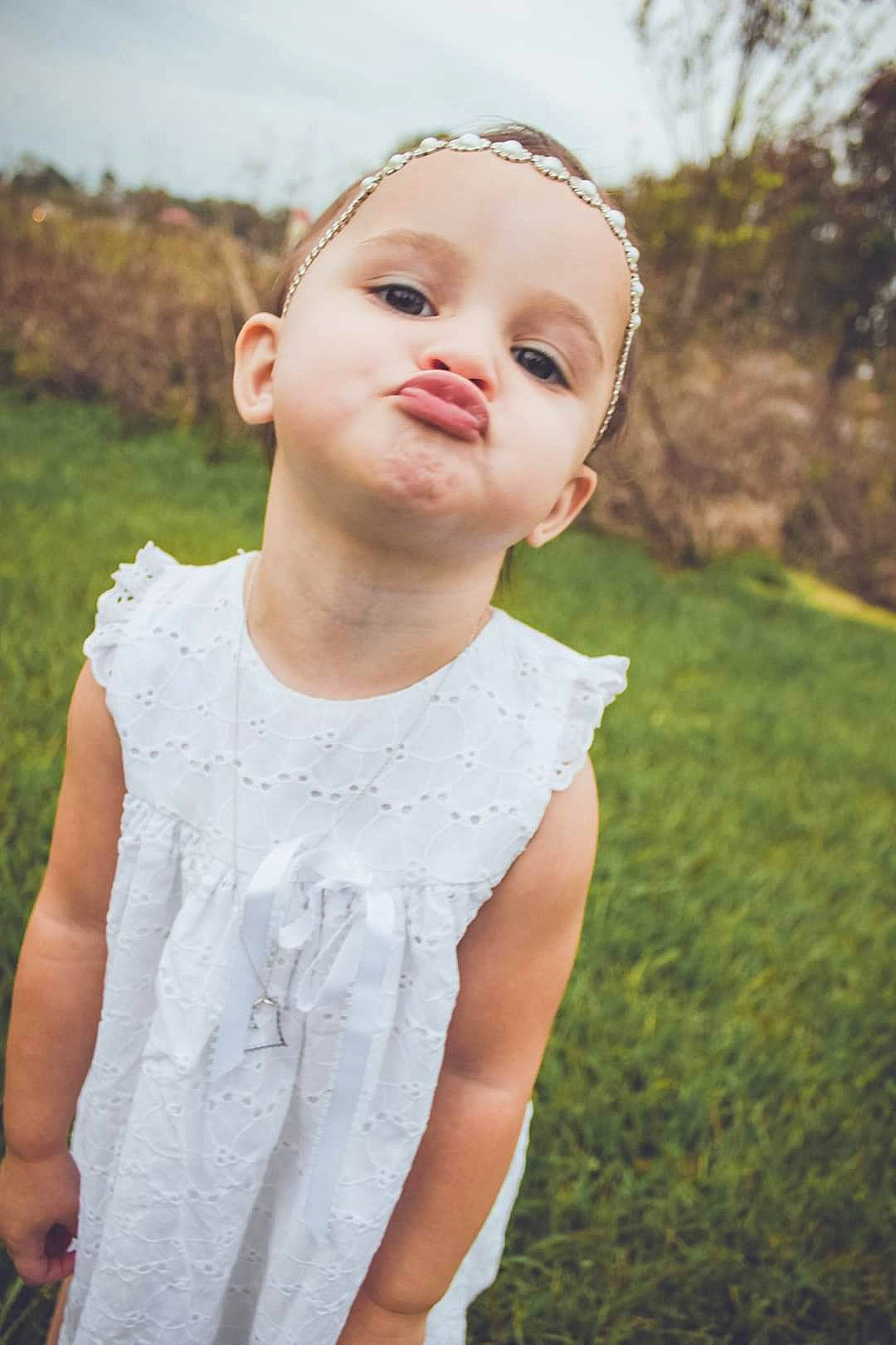 Annabelle is registered to the contest to win money with this photo: beauty, blond, child, dress, eye, face, grass, green, hair, head, lip, nose, person, photograph, pink, skin, smile, summer, sunlight, toddler